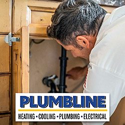 A plumber repairing a bathroom sink drain in Lafayette, CO