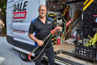 Plumber preparing to unclog a main sewer line