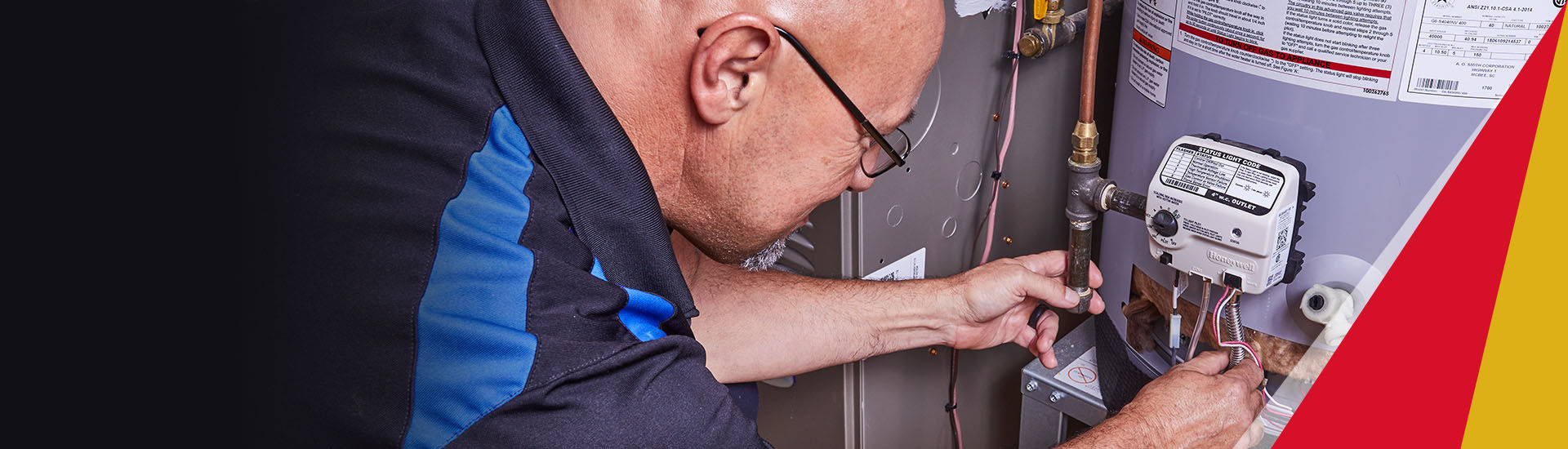 Ragsdale plumber inspecting a water heater in an Atlanta home