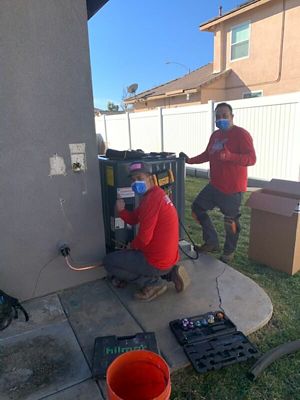 2 NexGen techs reapairing AC unit