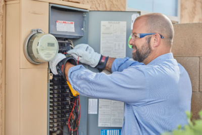 Technician working on electrical box 