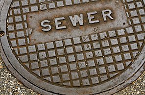 Public sewer lid that says SEWER