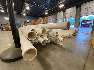 A stack of PVC piping in the warehouse