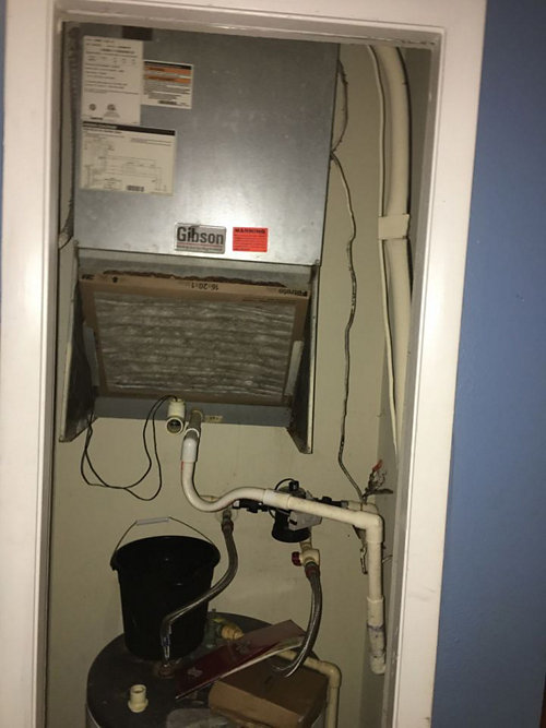 A metal box with pipes and a vent