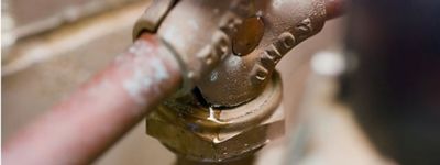 Close-up of a pipe with a valve