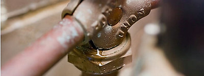 Close-up of a pipe with a valve