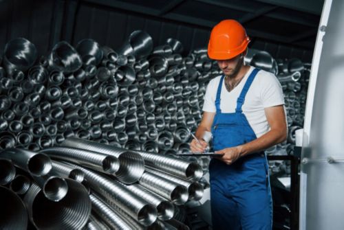 Plumber Inspecting Pipes