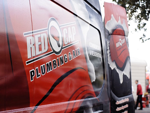 A red van with white and black logos