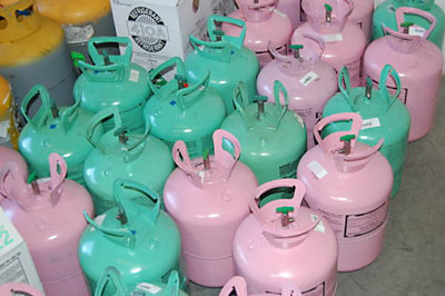 Pink and green refrigerant cannisters