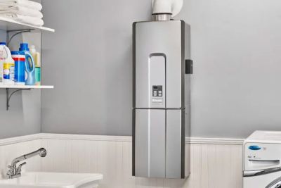 A Rinnai Tankless Water Heater in a laundry room area.