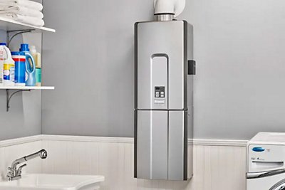 A Rinnai Tankless Water Heater in a laundry room area.