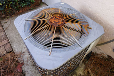 old air conditioning unit with rust