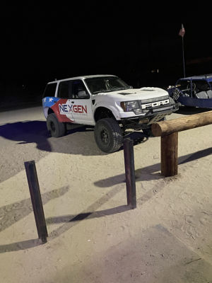 NexGen SUV parked in the sand