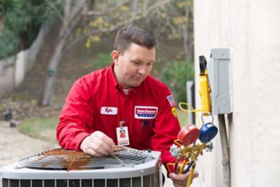 Service champion repairing air conditioner