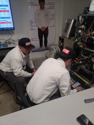 Two NexGen Techs working together