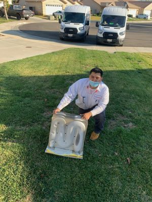 Technician holding HVAC equipment