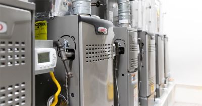 Technician repairing a furnace