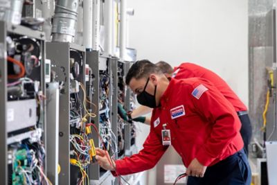 Technician repairing furnace