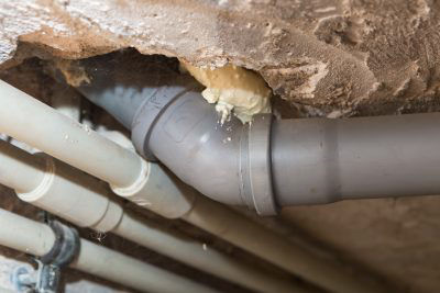 Sewer pipes exposed in home basement