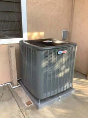 An AC unit connected to a building.