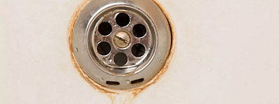 Water staining a drain in a sink - Thomas & Galbraith Heating, Cooling, & Plumbing