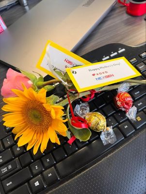 Sunflowers and Conady on a keyboard with a happy mother's day tag