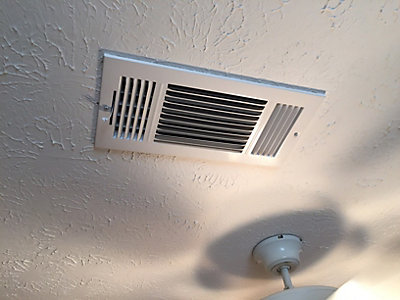 Supply vent in ceiling near ceiling fan