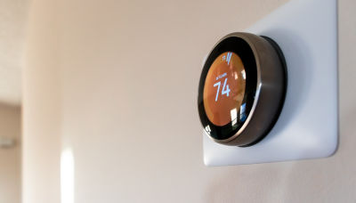 Smart thermostat showing 74 degrees