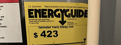 Closeup shot of a yellow Energy Guide sticker on a water heater