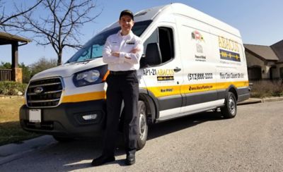 Technician standing in front of Abacus vehicle