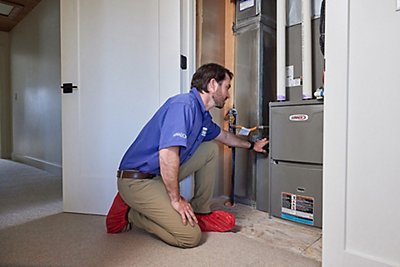 Tech working on furnace