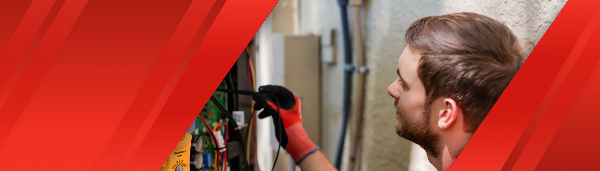 A Red Cap electrician inspecting an electrical panel in a Tampa home