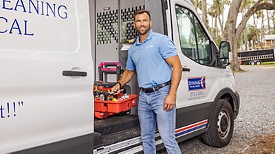 Technician running diagnostics on ac unit 