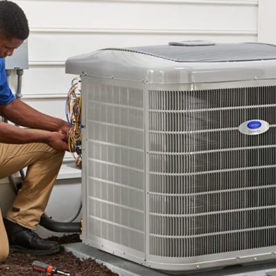 Technician working on a Carrier AC