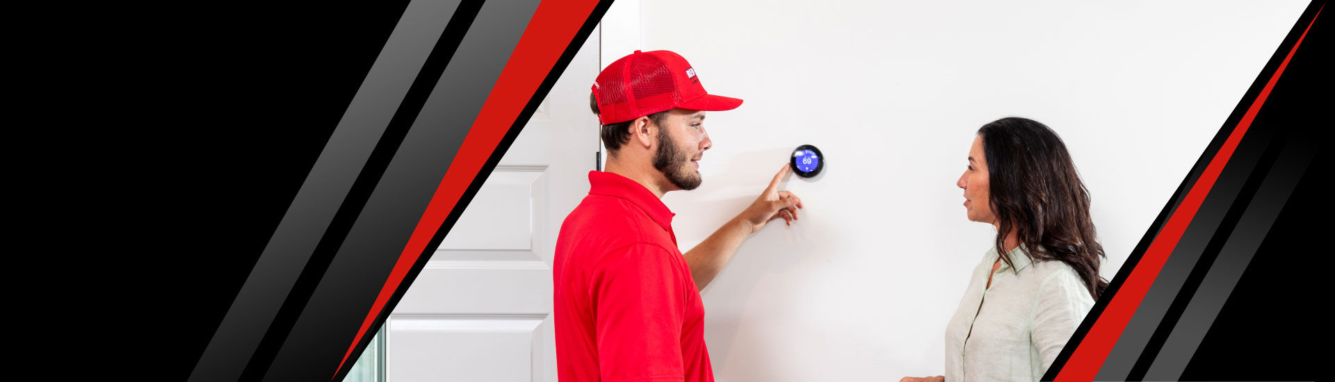 HVAC tech from Red Cap adjusting a thermostat in a Tampa home