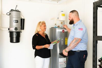 Plumber talking with a Largo, FL homeowner