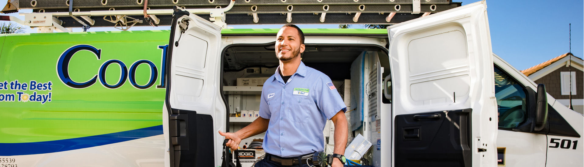 Cool Today - Cooling, Plumbing, Electrical technician smiling in front of van