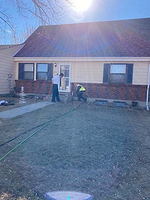 plumbers working outside 