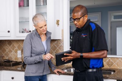 Coolray technician pointing at options on tablet