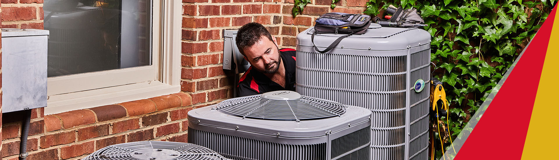 Technician working on AC unit