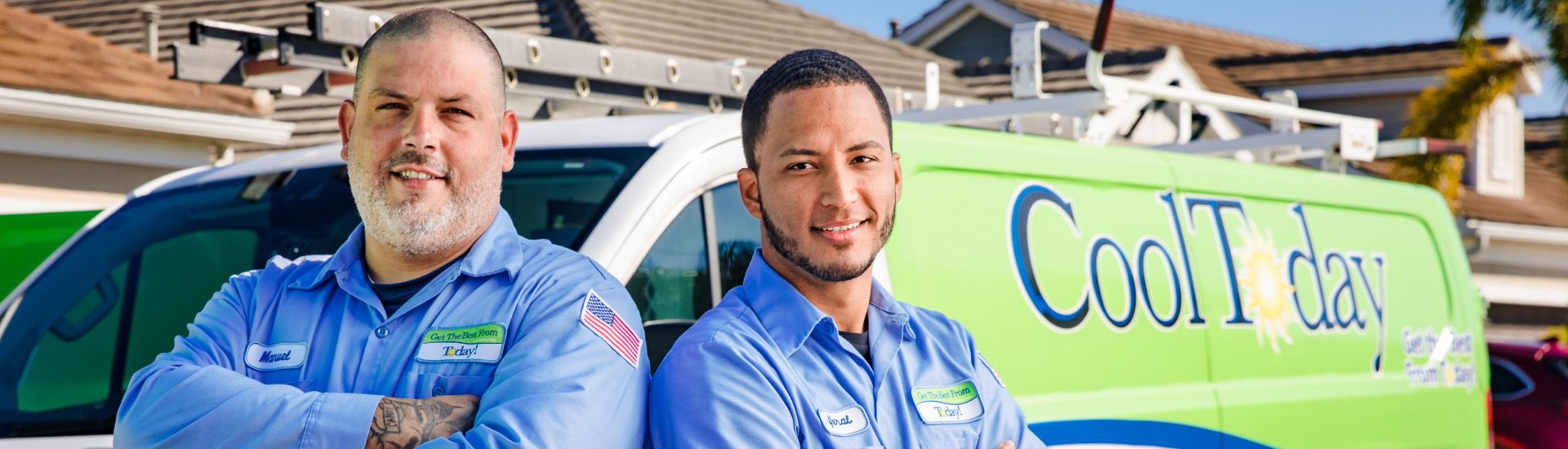 Plumbers in front of a service van