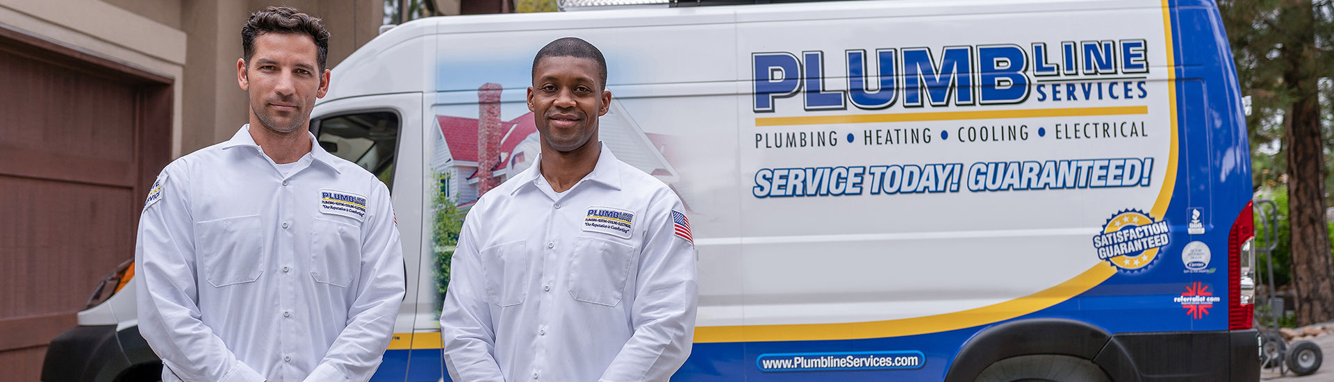 Two plumbline technicians standing in front of van