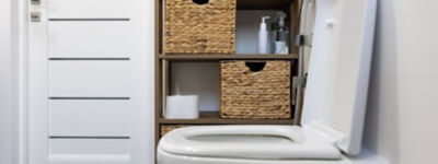 A Shelf with Baskets and Toilet