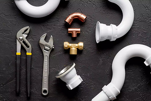 Tools and parts used in plumbing repairs 