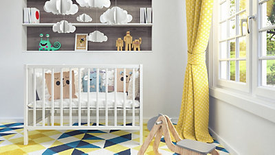 Stylish nursery with yellow polka dot curtains