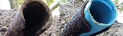 Rusty and cracked cast iron pipe with new trenchless liner