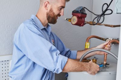 man-performing-water-heater-repair