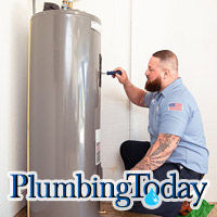 Plumber repairing a water heater in an Orlando home