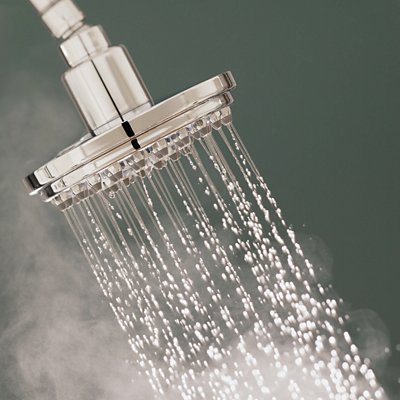 shower head with hot water steam around it