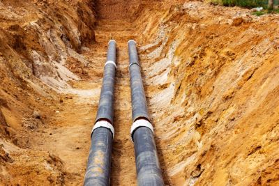 Installation of the distribution unit of heating and water supply network. Frame for connecting pipes in the trench of ground.